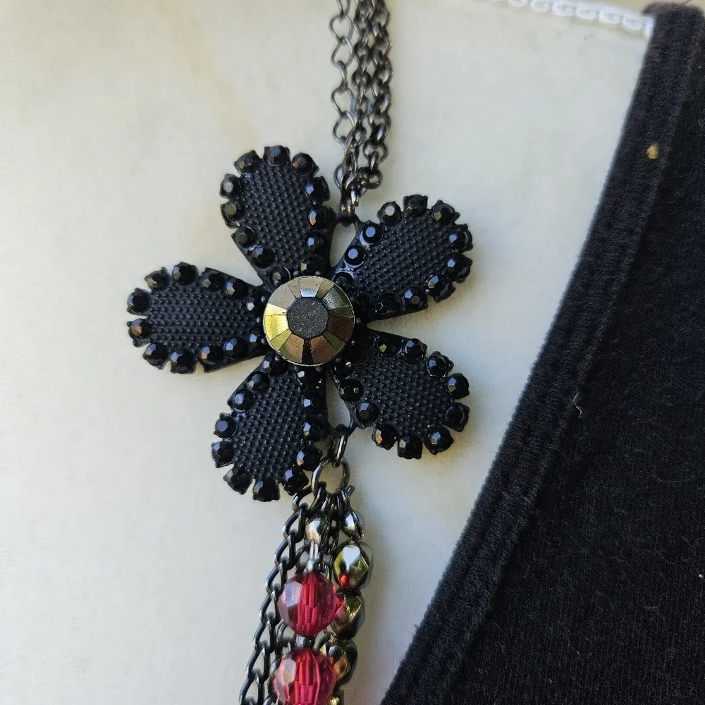 dark layered necklace with red beads flower spider fly charms